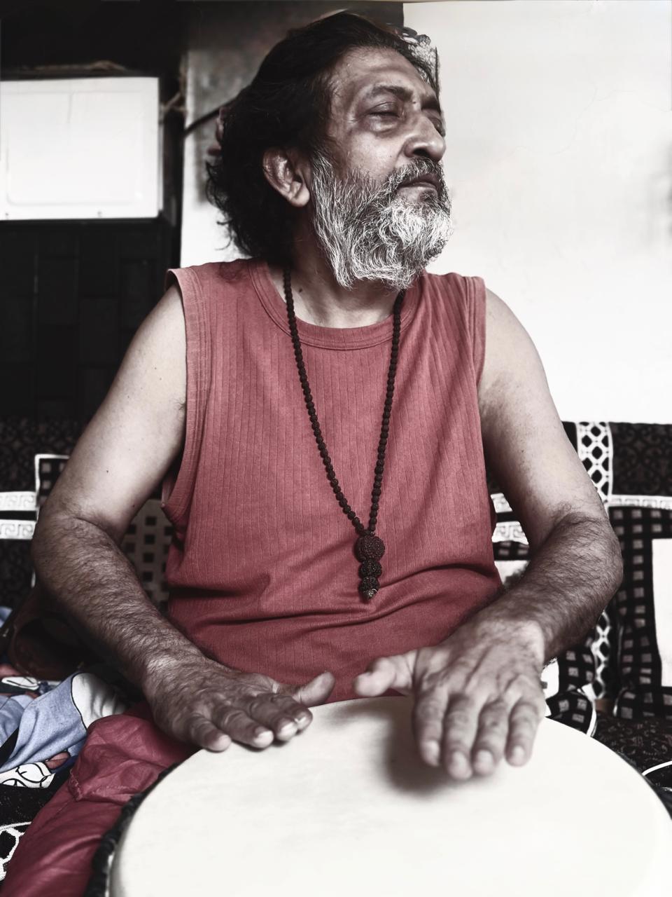 Guruji playing a drum